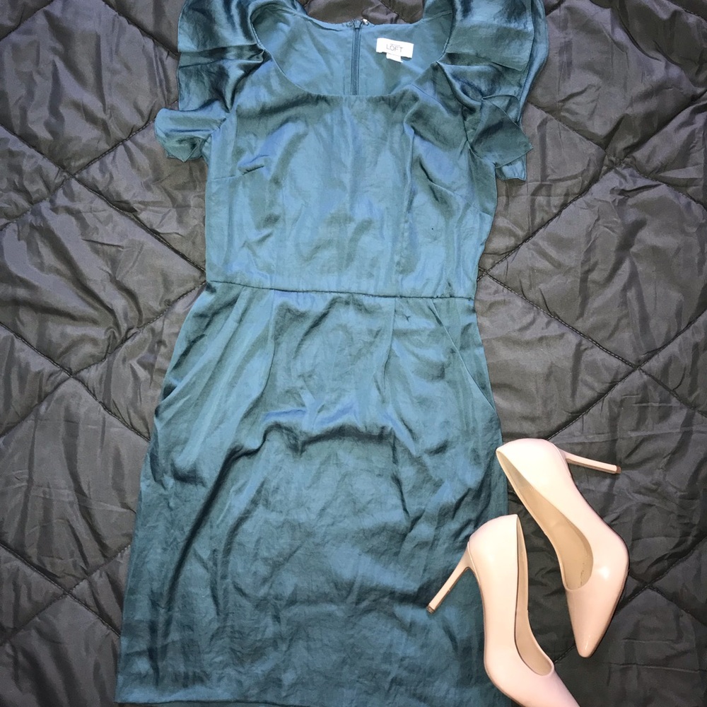Turquoise satiny dress with cute ruffle sleeves.